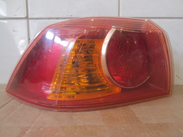 Фонарь задний наружный левый Mitsubishi Lancer 2007>